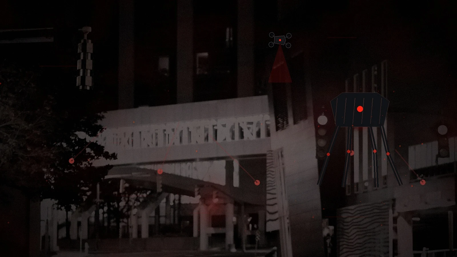 A city street sinking into darkness as the electrical grid fails and isolated emergency lights remain