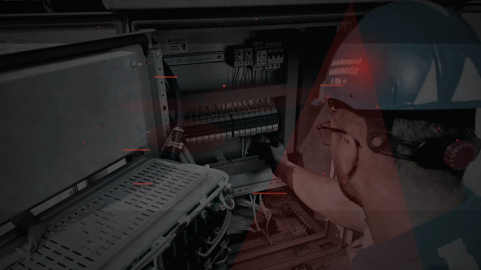 An electrician inspecting a household electrical control cabinet during backup-power planning