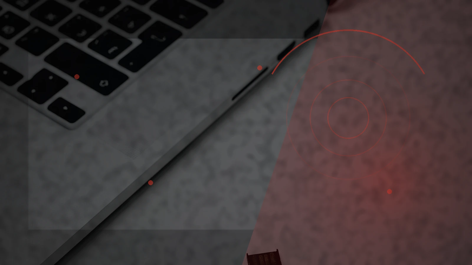 Hardware security key beside a laptop, illustrating stronger account authentication in an AI scam era